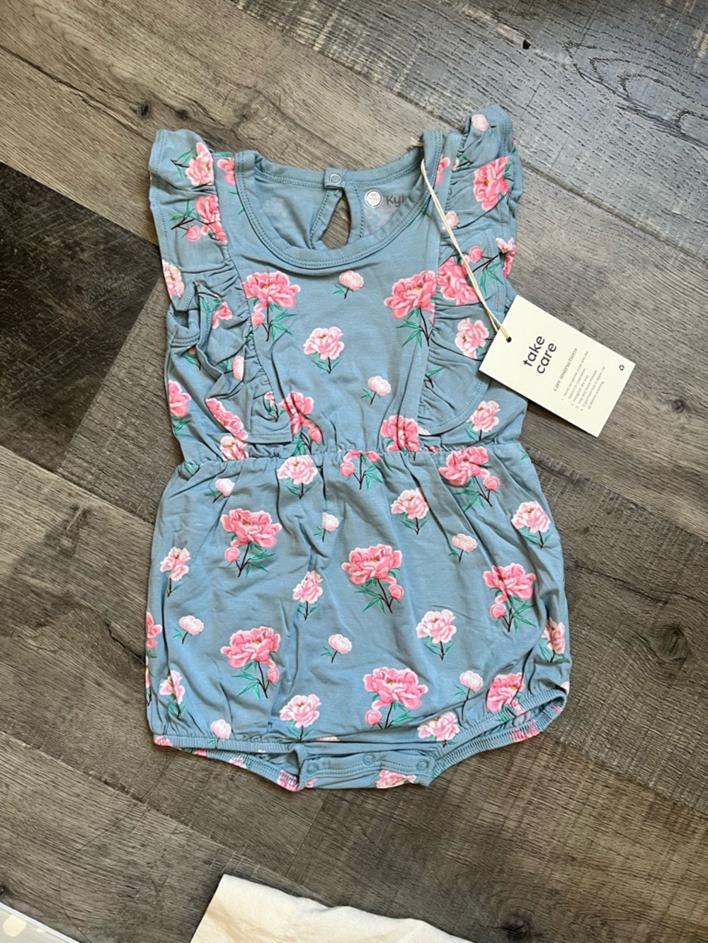 Kyte BABY Blue Floral Ruffle Romper with Pink Blooms